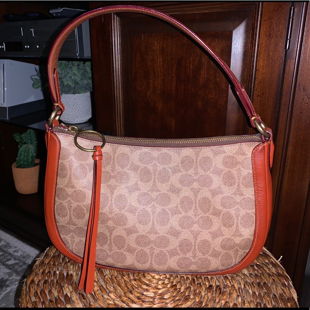 Coach Coated Canvas Signature Sutton bag (cross strap not included)